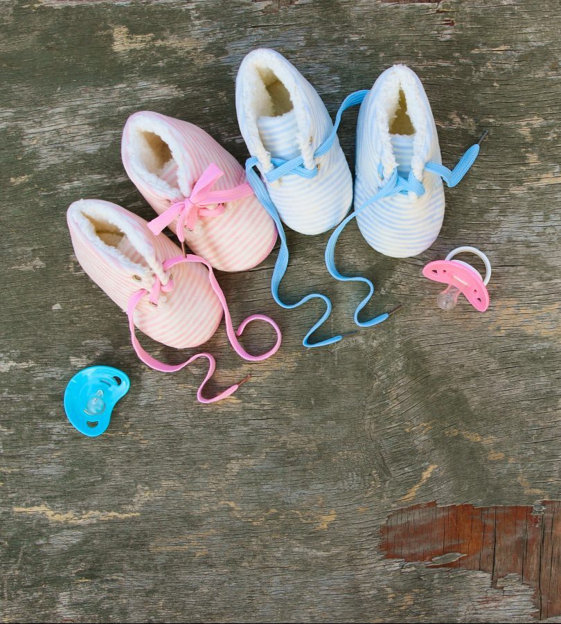 2022-new-year-written-laces-children-s-shoes-pacifier-old-wooden-background-top-view-flat-lay-space-text